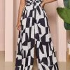 Geometric Print Commuting O-Ring Backless Jumpsuit
